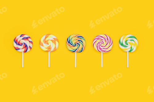 Preview: Five Fruit Rainbow Swirl Flat Lollipops in a row.