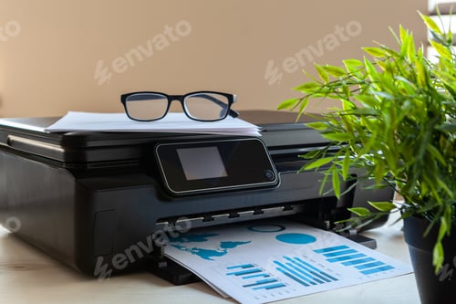 Preview: Front view of a black printer machine on a table