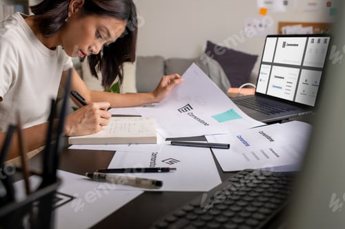 Preview: Asian woman Graphic designer working in office.