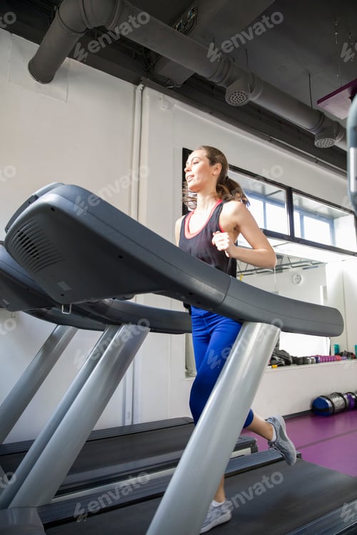 Preview: Young woman exercise on the treadmill at the gym