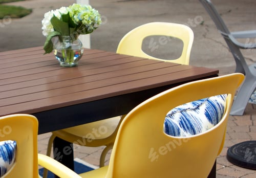 Preview: Yellow Patio furniture with blue pillows