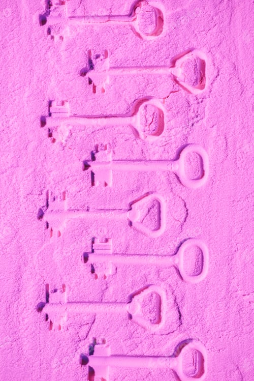 Preview: shapes of keys on pink colored powder texture