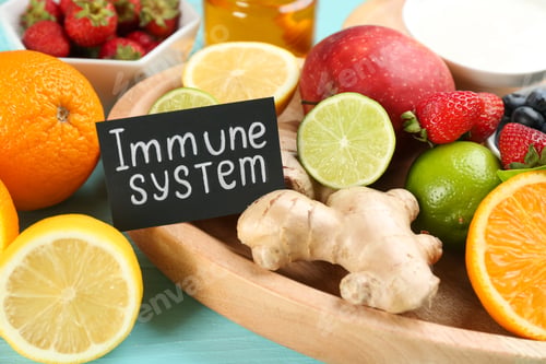Preview: Card with phrase Immune System and fresh products on table, closeup