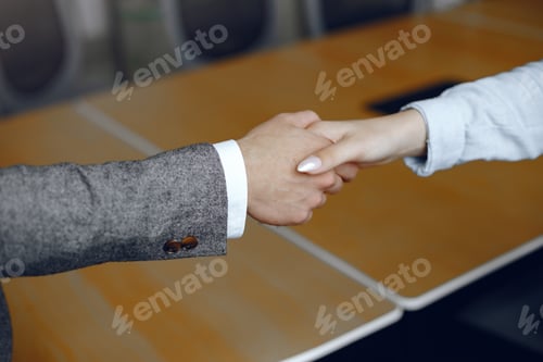 Preview: Handshake isolated on business background
