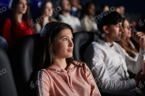 Preview: Young girl enjoying free time in movie theater