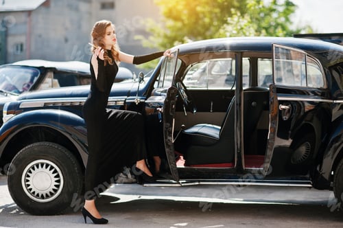 Preview: Girl model with bright makeup in retro style in vintage car