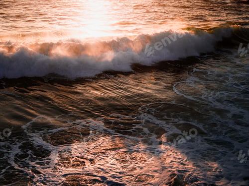 Preview: Sunset beach scene with waves crashing on shore