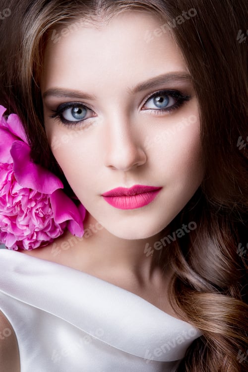 Preview: Close-up studio portrait of beautiful woman with bright make-up