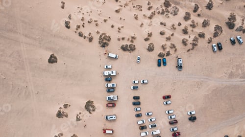 Preview: Above vertical view of parking on the ground in freedom nature outdoors park. Cars and vans