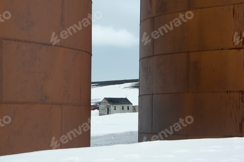 Preview: The tall sides of rusting metal whale oil tanks at the former whaling station on Deception Island.