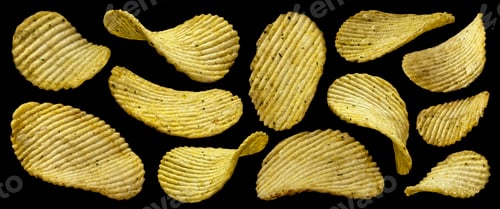 Preview: Ridged potato chips isolated on black background