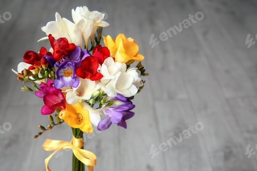 Preview: Beautiful freesia bouquet on blurred background