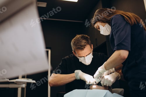 Preview: Painkiller anesthesia injection. Dentist examining a patient's teeth in modern dentistry