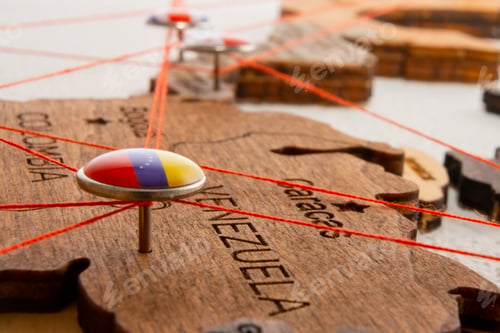 Preview: Venezuela flag on the pushpin and red threads on the wooden map