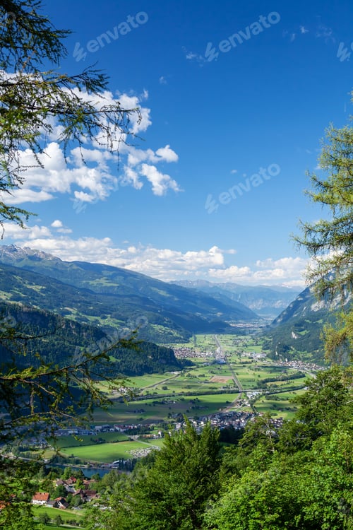 Preview: Panoramic view of countryside, green alpine meadows and mountains