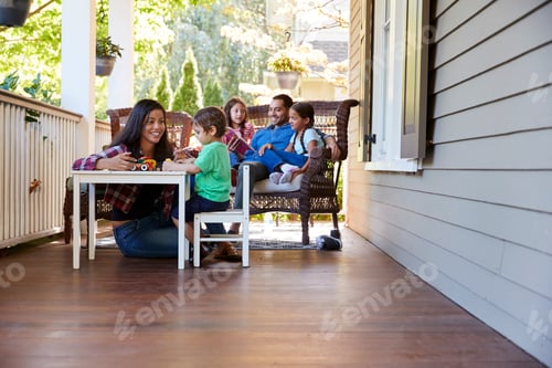 Preview: Family Sit On Porch Of House Reading Books And Playing Games