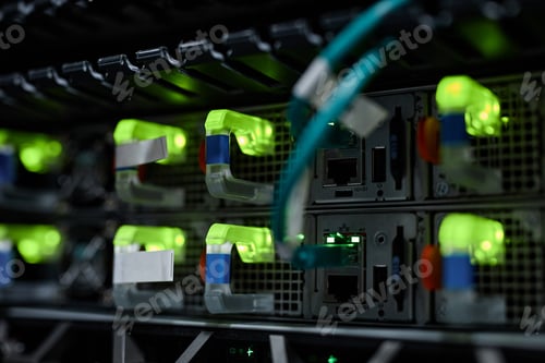 Preview: Background neon indicator lights in server cabinet with internet cables