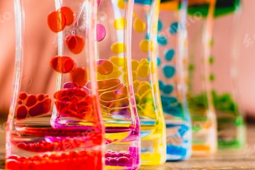Preview: Toy with water and drops of oil colors.