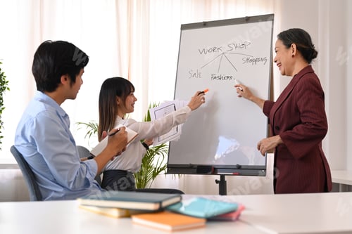 Preview: Experienced senior business leader giving a presentation, demonstrating business strategy