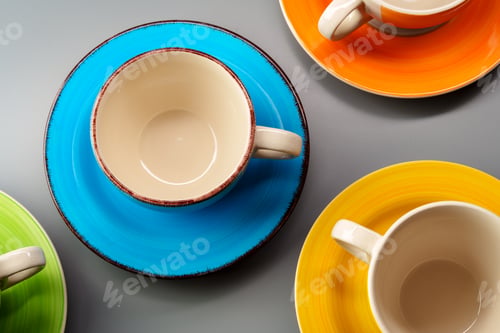 Preview: Colorful clay ceramic cups on gray background