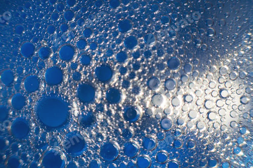 Preview: abstract light blue background with oil circles . bubbles of water close up .
