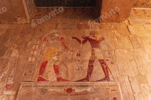 Preview: Ancient egyptian pharaoh receiving offerings in a colorful wall relief