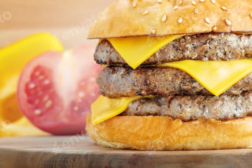 Preview: Fresh burger with cheese on wooden background