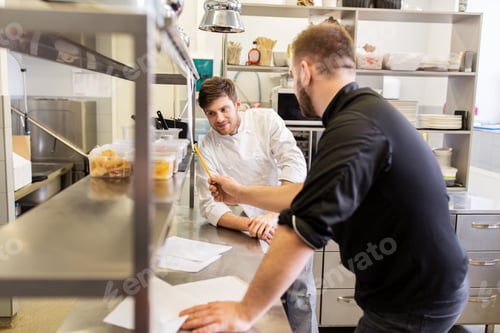 Preview: chef and cook with grocery list at kitchen