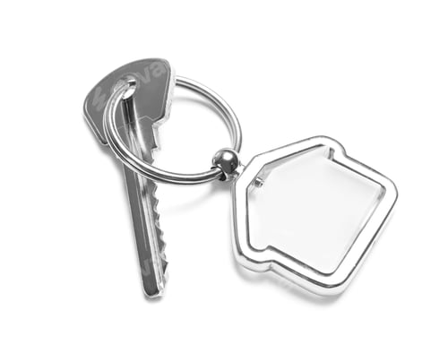 Preview: House key with trinket on white background