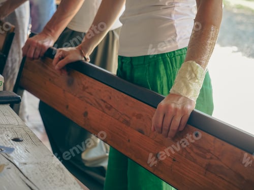 Preview: woman wrist wrapped with cabbage leaves compress for anti inflammatory pain relief.