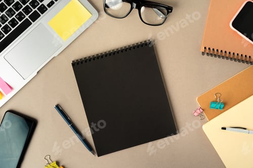 Preview: Open laptop with blank notebook, view from above. Workplace concept