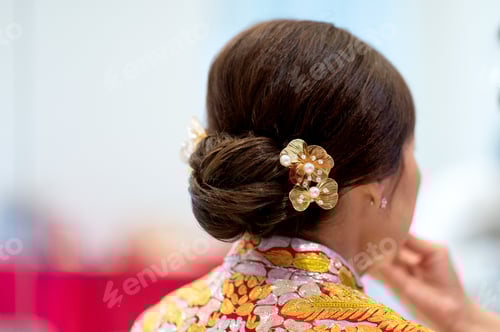Preview: Brunette with Updo and Flower Hair Accessories