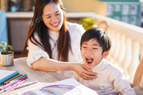 Preview: Asian mother and child having playful time together at home patio - Focus on little boy screaming