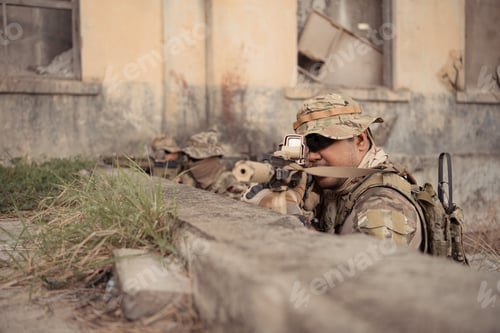 Preview: Professional marine soldiers training with weapon on a military range.