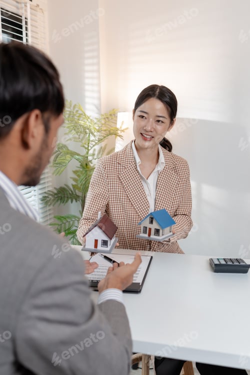 Preview: A real estate agent discusses property contracts with a client