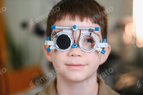 Preview: Child undergoing vision diagnostics using phoropter at ophthalmologist clinic