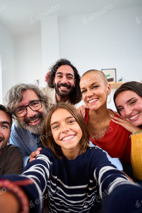 Preview: Joyful Caucasian family smiling hugging taking a selfie photo indoor. Happy people in domestic life.