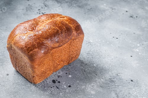 Preview: Homemade Baked Braided Brioche bread. Gray background. Top view. Copy space