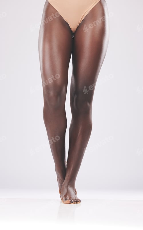 Preview: Beauty, skin and legs by black woman in studio for skincare, laser and hair removal against white b