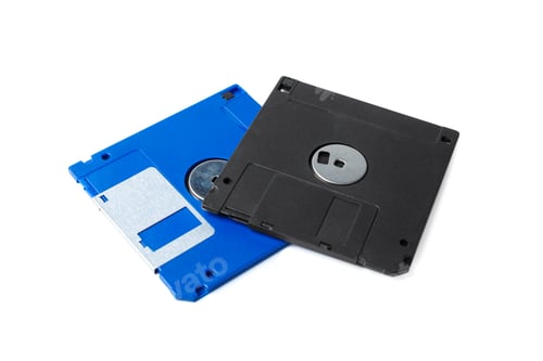 Preview: Old floppy disks on a white background showing data storage technology from the past