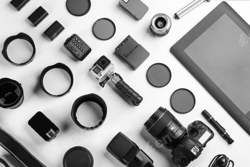 Preview: Composition with photographer's equipment and accessories on white background, top view