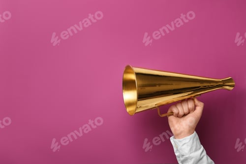 Preview: Man holding megaphone on color background