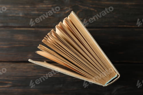 Preview: Book on wooden background, top view. Self-development