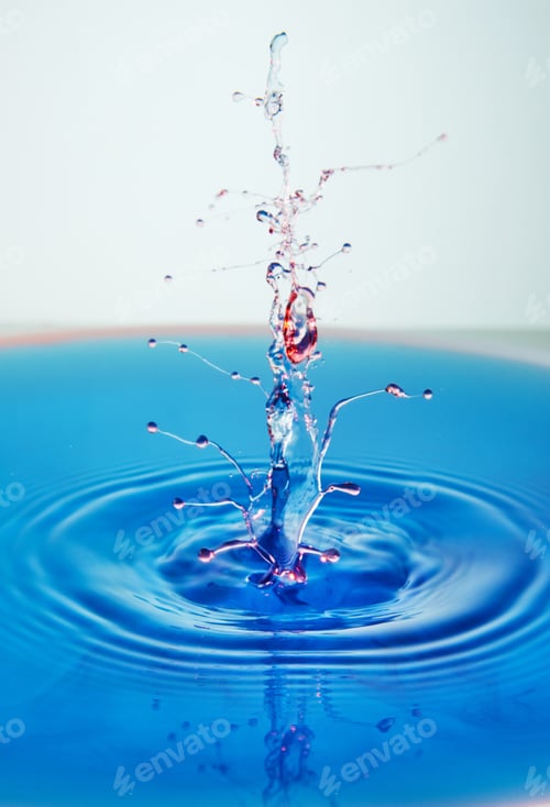 Preview: Abstract background of splash of color water, collision of colored drops, the concept