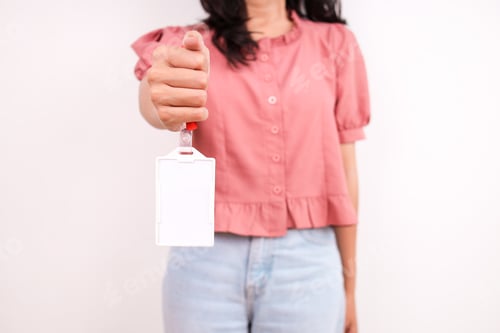 Preview: Young Woman Holding Up Blank White ID Card By Red Lanyard
