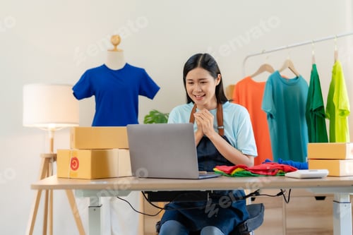 Preview: Small business owner Asian woman who are delighted with successful at home.