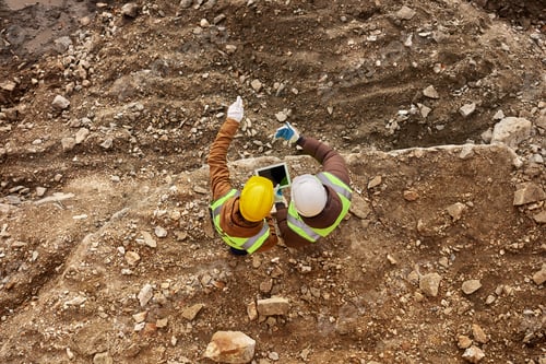 Preview: Two Workers Inspecting Site