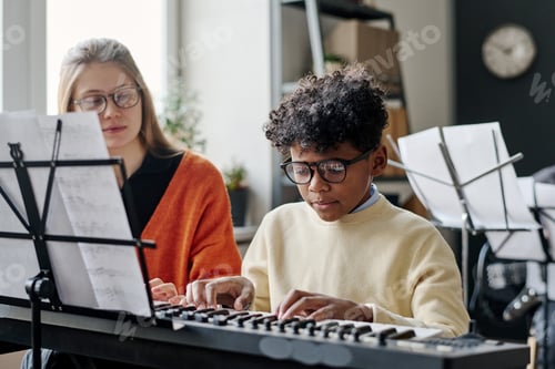 Preview: Black Boy Learning To Play Synthesizer