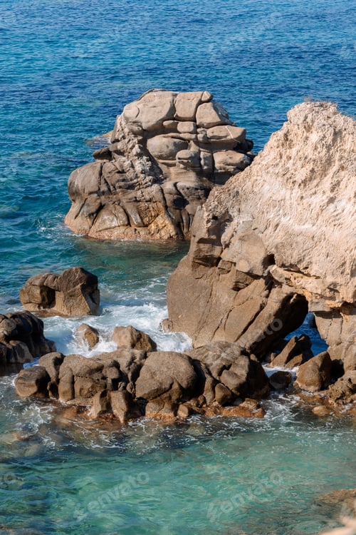 Preview: Waves on rocky beach, sea shore with waves crushing over the big rocks