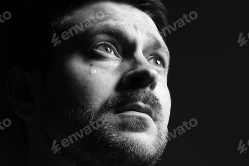Preview: Sad man crying on dark background, space for text. Black and white effect